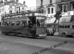 Tram with Triumph car and Trojan van / Llandudno and Colwyn Bay, 7 / MAT0038q