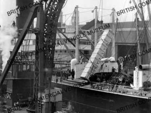 Parts being loaded onto ship / L007804a